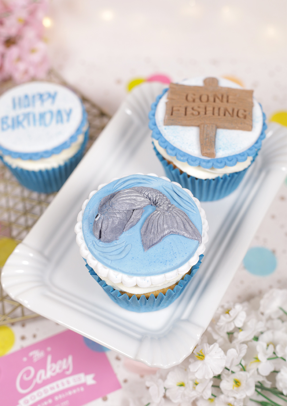 Fishing themed cupcakes with fondant toppers